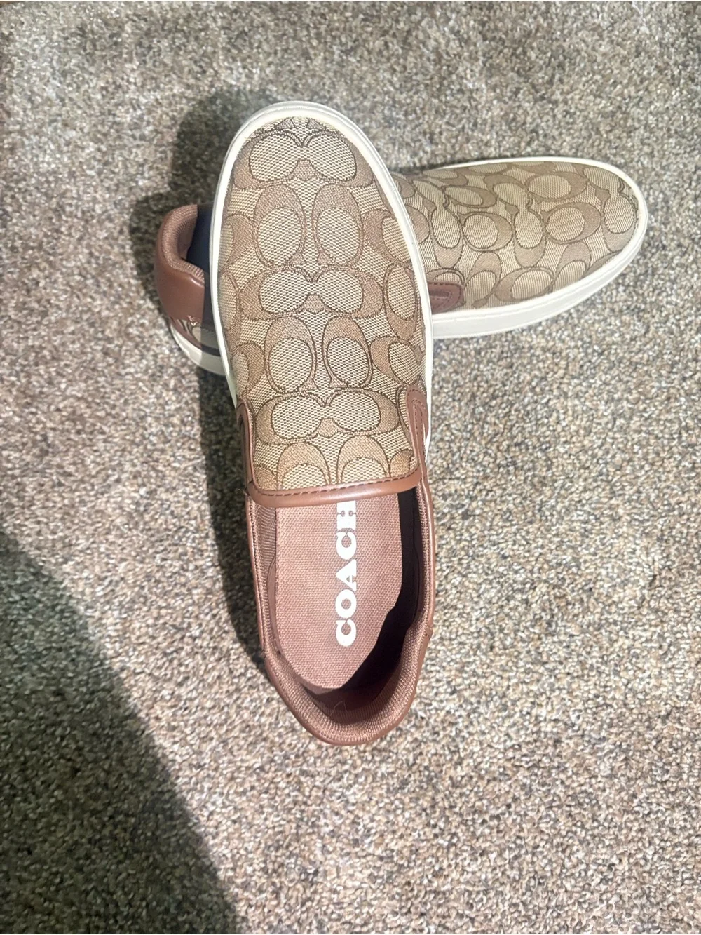 Coach women’s Brown Signature Slip-On Sneakers
